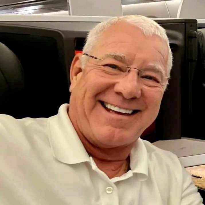 Dr. Stephen H. Pinkston smiling on a flight